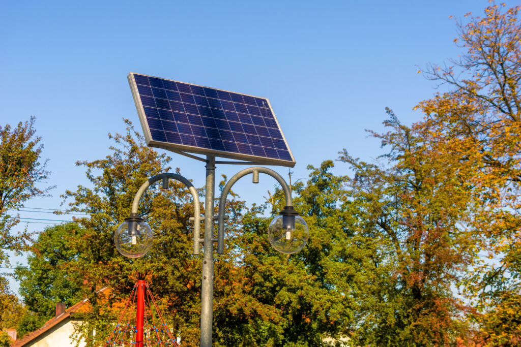 photovoltaic panels powering the lighting of street lamps in the