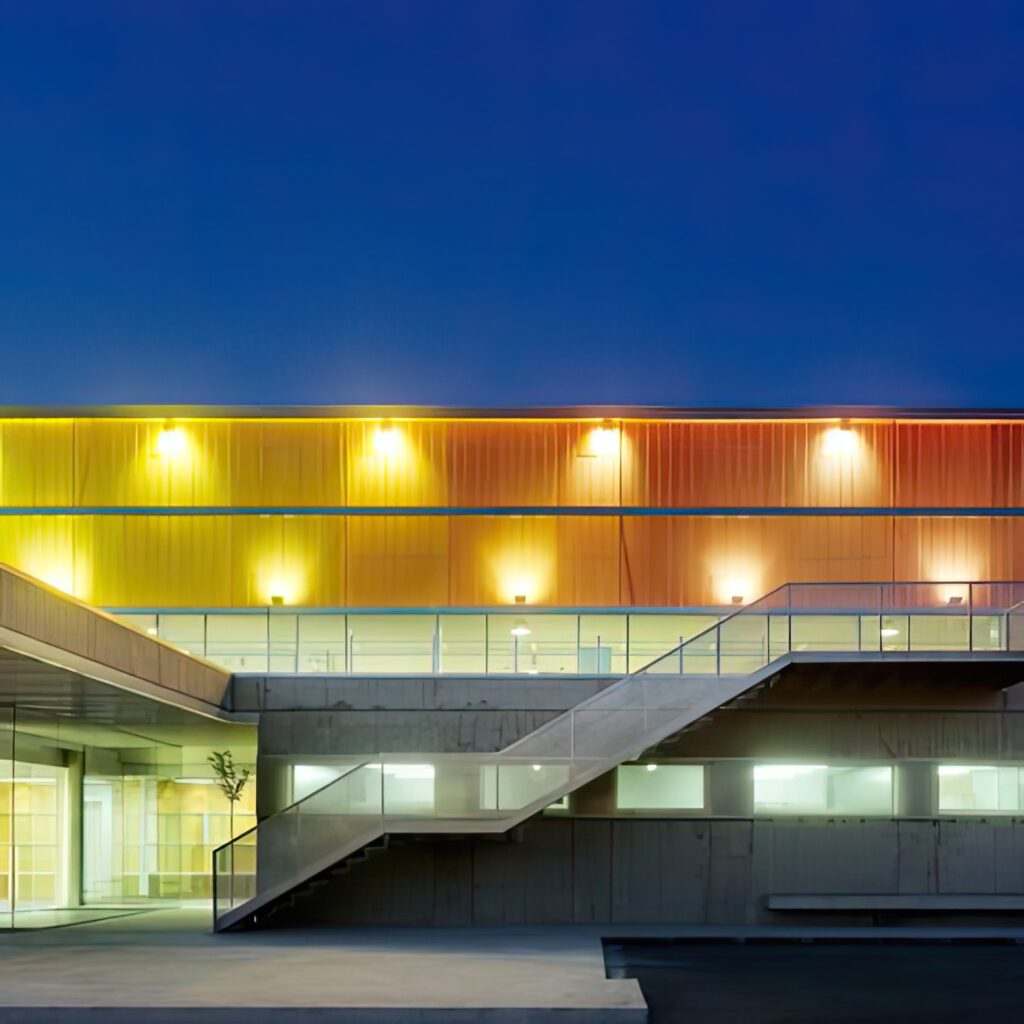 building with yellow orange exterior with word it