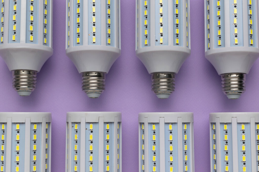 Energy Efficient LED Bulbs Arranged in Stylish Pattern on Purple Background